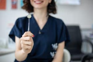 Dentist holding a mouth mirror